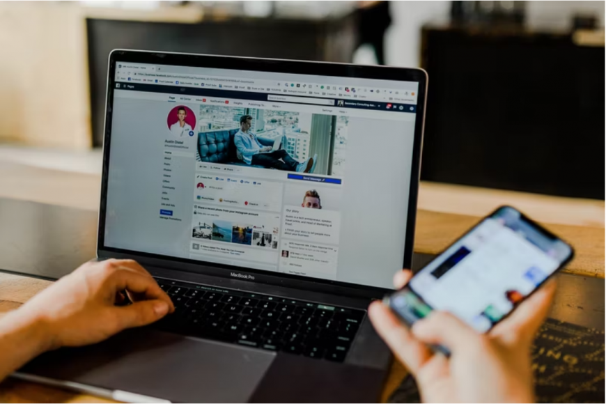 Facebook Profile website on a laptop.